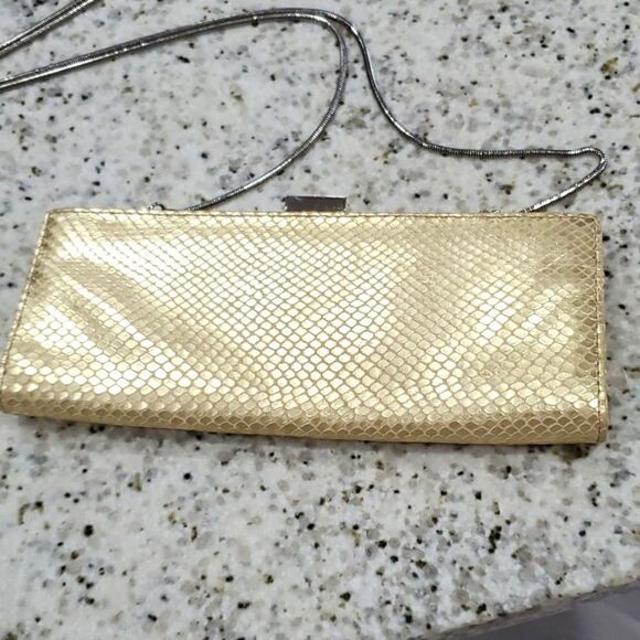 Adrienne Vittadini womans gold leather clutch with cross body strap - Picture 2 of 8